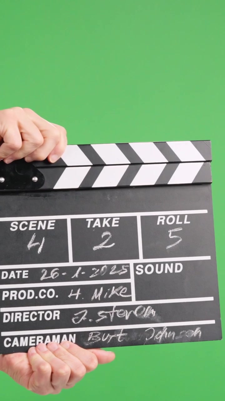 Film slate clapping on green screen for video production