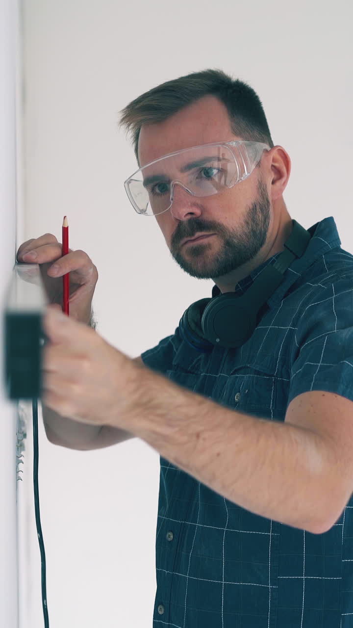 Dolly cam shot: professional builder with modern level tool shakes hand of female colleague in spacious renewing room