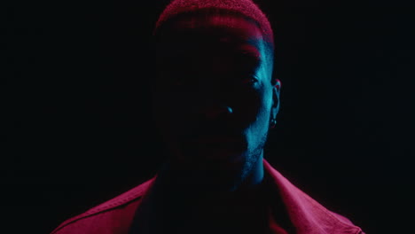 video portrait of black man in neon lights