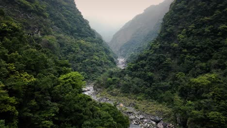 taiwan hualien taroko gorge national park, misty mountains wildernessdeep steep remote wild river valley through lush green forest jungle