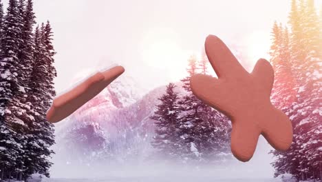 animación de galletas de jengibre de navidad sobre copos de nieve que caen y paisajes de invierno