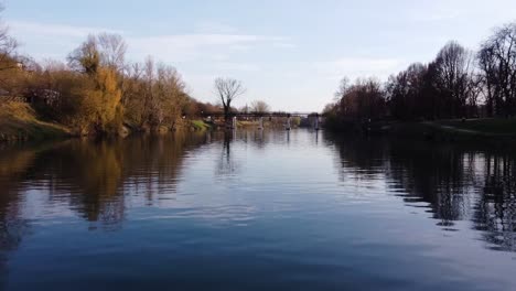 Cinematic-60fps-aerial-shot-flying-low-over-river