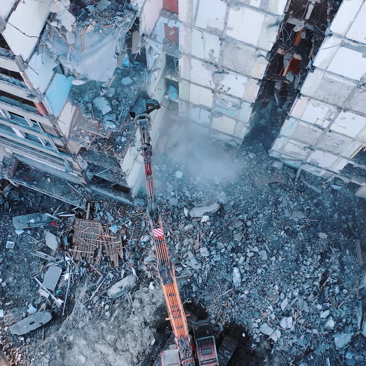 Construction of destroyed house. Destructive demolition building by excavator