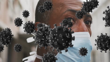 animation of covid 19 cells over african american man wearing face mask