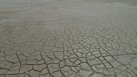 cracked wet and muddy grey surface of the