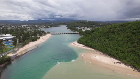 tallebudgera creek beach, caldwell cove and tallebudgera creek bridge in gold coast, qld, australia. - aerial shot