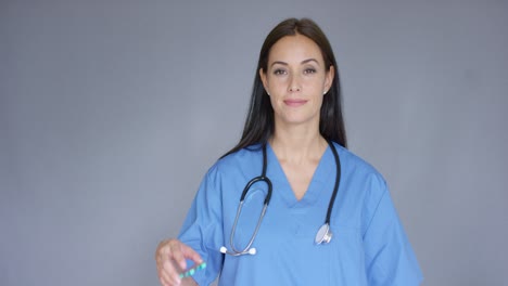Doctor-with-stethoscope-holding-package