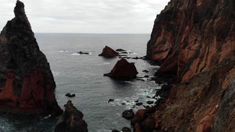 Drone-captures-the-stunning-cliffs-around-Sao-Lourenco-on-Madeira-island,-showcasing-rugged-coastlines,-turquoise-waters,-and-dramatic-natural-beauty-from-a-breathtaking-aerial-perspective