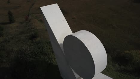 aerial drone orbiting over national resistance monument, plateau des glières in haute-savoie, france