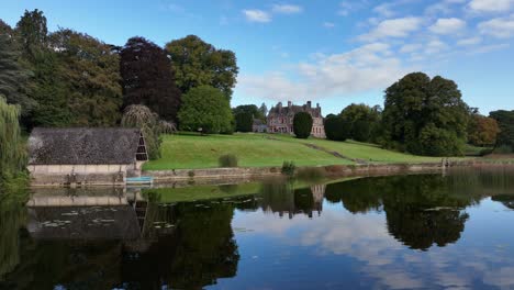 reflective lake view of a historic estate