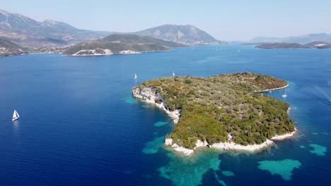 aerial drone view meganisi island, lefkas, greece - sailing boats, blue sea, reef and mountains