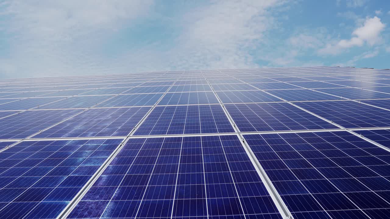 Solar power station. solar panels on a background of blue sky with clouds