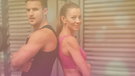 animation of light spots over diverse people exercising at gym