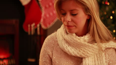 pretty blonde sipping wine at christmas