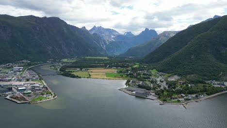 andalsnes city in rauma, more of romsdal, norway - aerial 4k