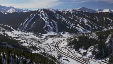 copper mountain colorado winter december christmas aerial drone cinematic landscape i70 leadville silverthorne vail aspen ten mile range blue sky clouds past rocky mountains parallax forward zoom