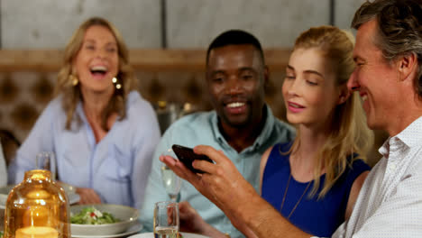man taking selfie with friends on a dinner table 4k 4k