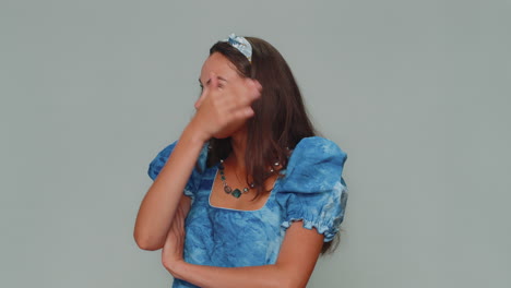upset pretty young woman making face palm gesture, feeling bored, disappointed in result, bad news