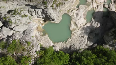 aerial drone headshot of albanian canyon "syri i ciklopit