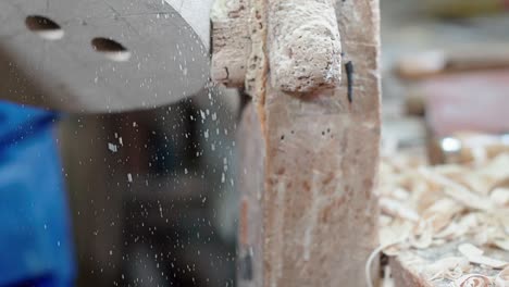 Sawdust-of-sanding-process-flys-through-the-air-in-a-workshop