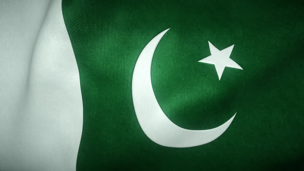 la bandera de pakistán ondeando en el viento
