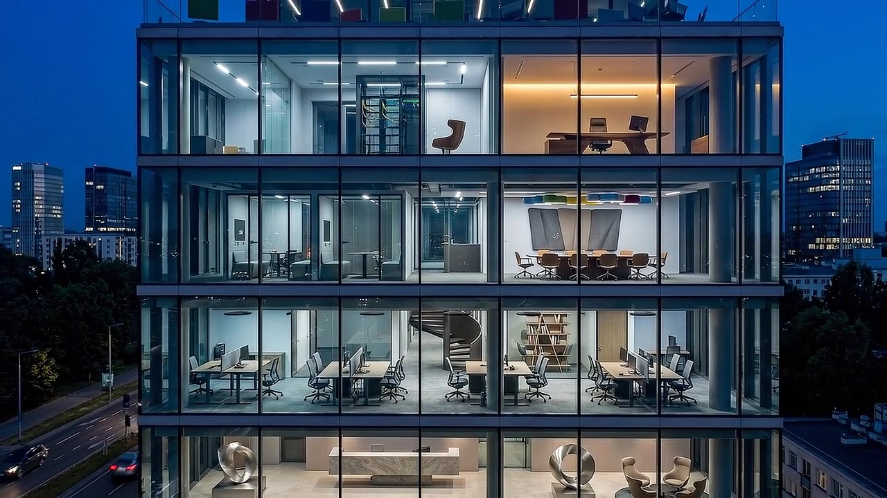 Contemporary office complex with panoramic glass windows at twilight