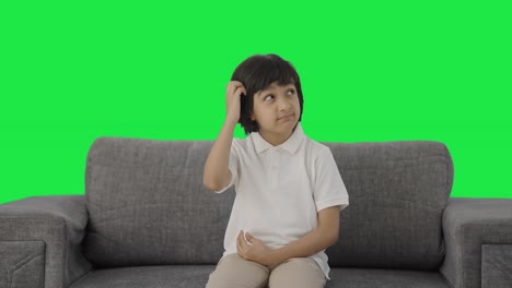 Confused-Indian-boy-thinking-something-Green-screen