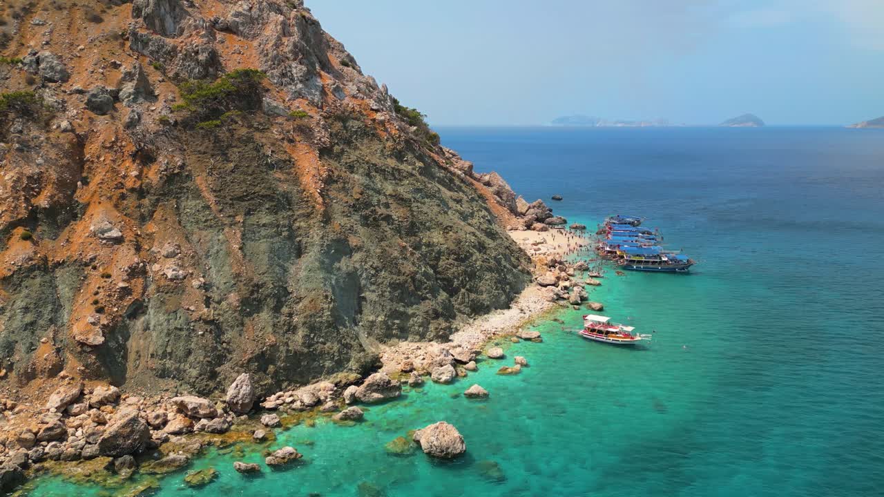 Stunning aerial footage captured by drone showcasing the crystal-clear turquoise waters and white sand beaches of Suluada Island - 4K Cinematic Drone Footage - Suluada - Turkey