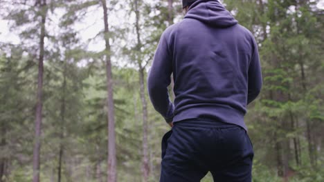 man exercising in the forest