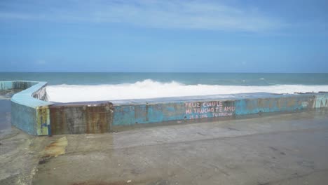 coastal view with graffiti and waves