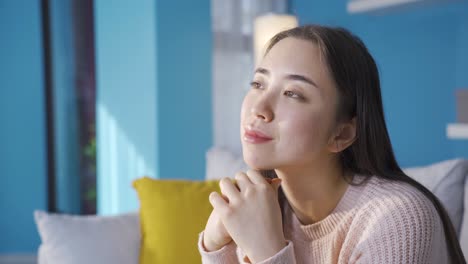 positive thoughtful asian young woman happy.