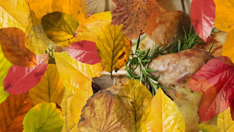 animation of autumn leaves over thanksgiving dinner background