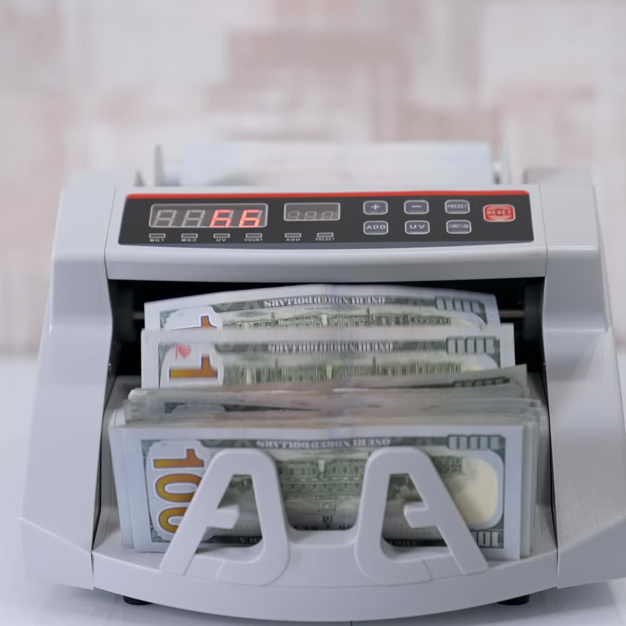 Money counting machine. Counting dollar banknotes