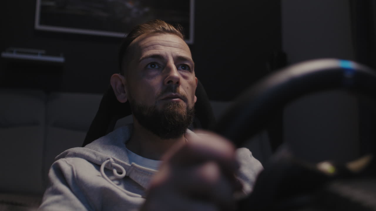 Man Concentrating on a Racing Game