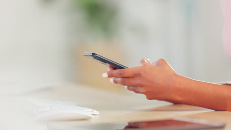 social media manager holding a phone and texting