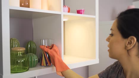 wiping dust with cloth. woman cleaning the house.