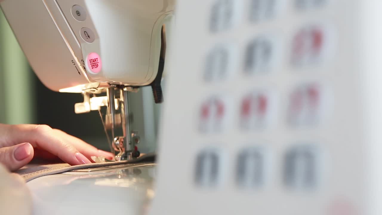 Seamstress Sews Clothes. Creative young fashion design using sewing machine, making clothes