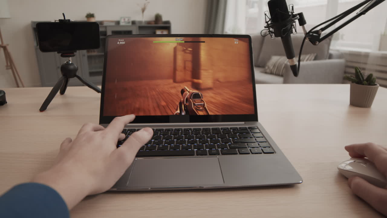Playing a first person shooter game on a laptop