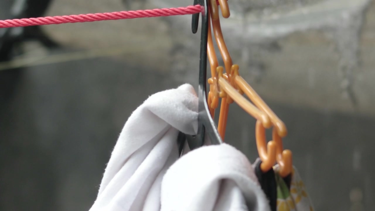 Laundry Hanging on Clothesline With Rainy Weather in Background
