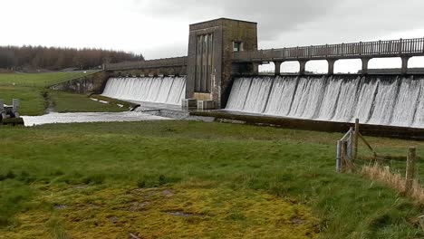 llyn cefni reservoir overflowing from llangefni lagoon dam water in the anglesey countryside