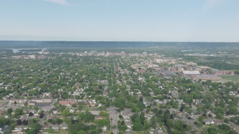 drone footage of residential area of la crosse in wisconsin, usa. cityscape surrounded iin greenery.