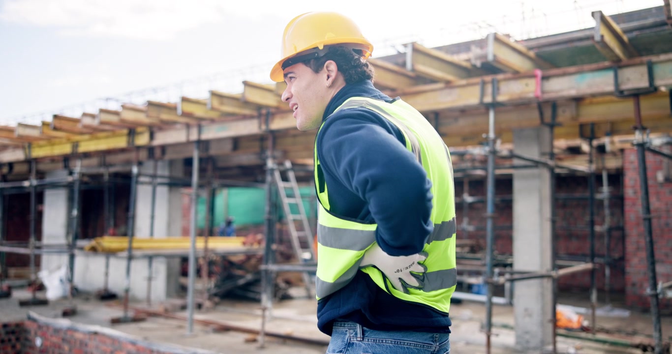 Construction Worker Suffering From Back Pain on Building Site