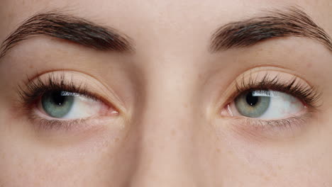 close up blue eyes blinking beautiful woman natural color healthy eyesight concept
