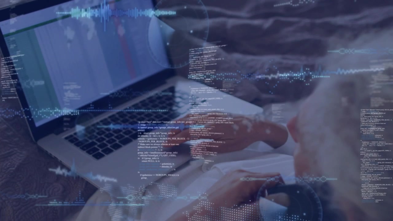 Woman reclining on bed tapping trackpad and bringing code waveforms over sheet for IT monitoring