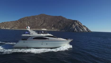 aerial shot of a luxury yacht cruising in cabo pulmo national park, baja california sur