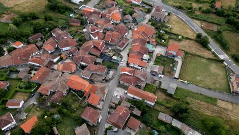 bird's eye view of red orange spanish roofs in countryside near ourense