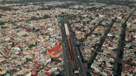 Overhead-view-of-Mexico-City's-traffic-and-skyline