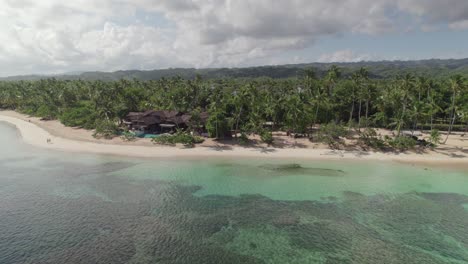 aerial shot over tropical beach bar restaurant in las terrenas, dominican republic