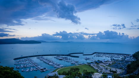 Airlie-Beach-marina-timelapse-from-the-top-Queensland-Australia-heart-of-the-Whitsundays-on-the-beautiful-tropical-coast-Coral-Sea-Resort-for-boating-and-Yacht-sunset-with-clouds
