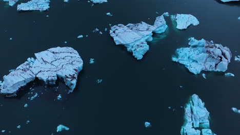 floating icebergs on jokulsarlon glacier lagoon at sunrise in south iceland